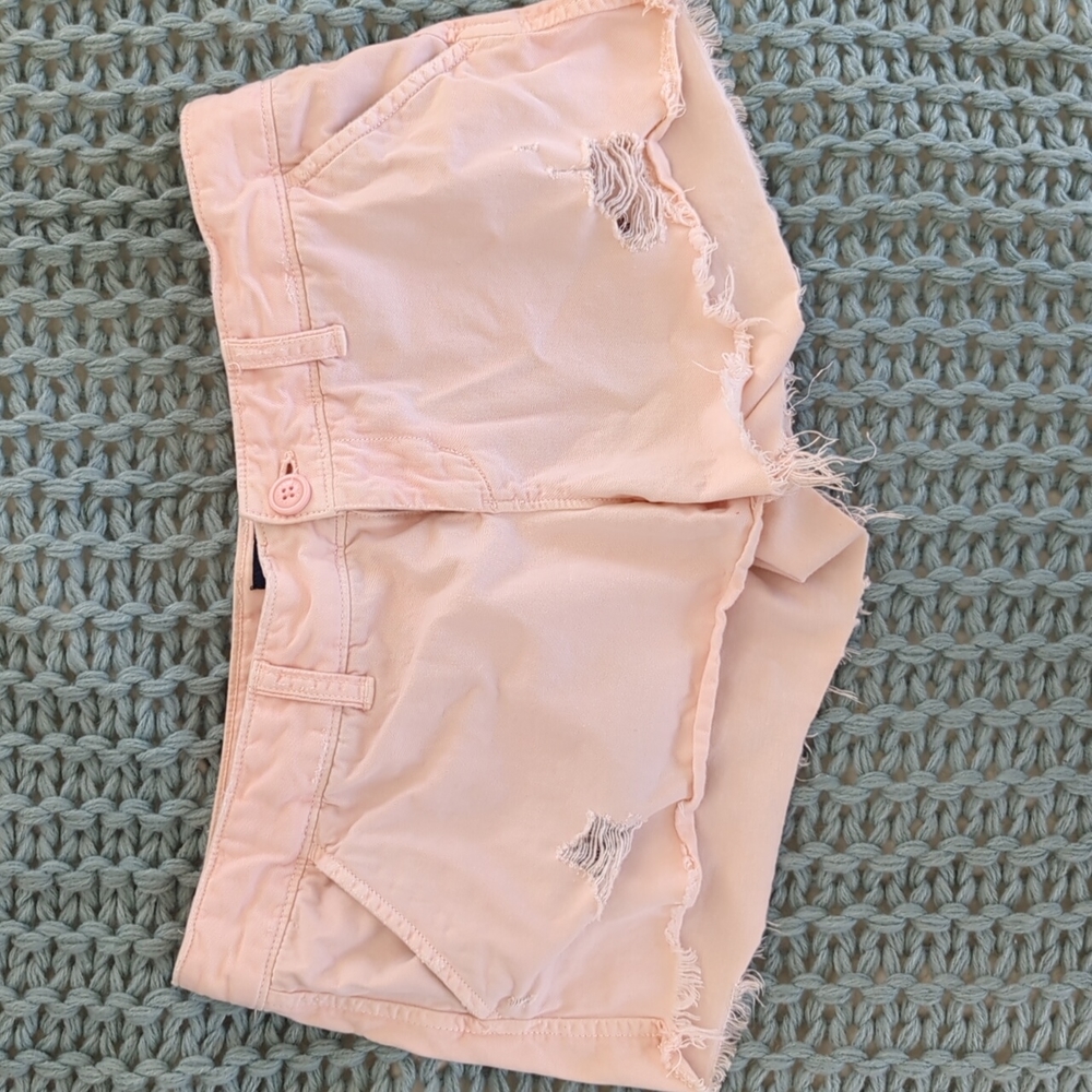 Light pink distressed shorts